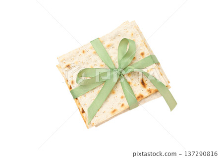 Passover features matzo tied with a green ribbon, isolated, PNG Passover features matzo tied with a green ribbon, isolated, PNG 137290816