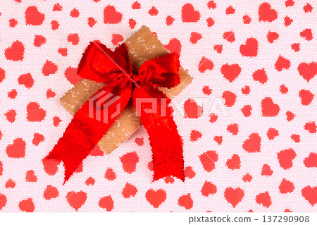 Valentine's Day. Presented as a red ribbon on a white paper with red hearts Valentine's Day. Presented as a red ribbon on a white paper with red hearts 137290908