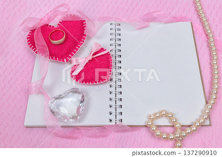 Valentines day hearts and notepad for your text. Top view on wooden table Valentines day hearts and notepad for your text. Top view on wooden table 137290910