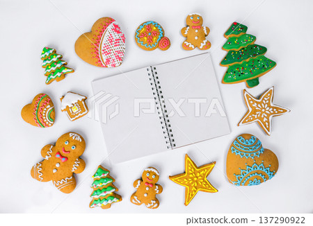 Christmas homemade gingerbread cookies on a white background. Christmas homemade gingerbread cookies on a white background. 137290922