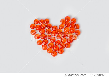Heart of red beads on a white background. Valentines day Heart of red beads on a white background. Valentines day 137290929