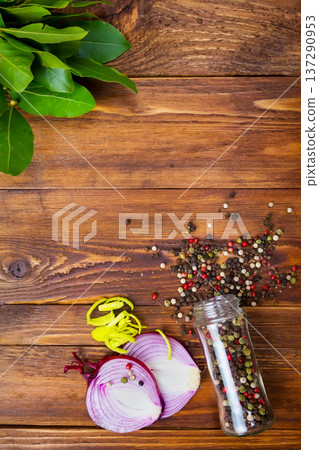 DIFFERENT SPICES FOR COOKING FOOD ON A DARK WOODEN BACKGROUND 137290953