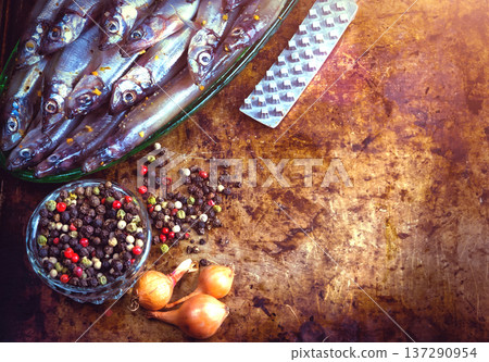 Fresh fish top view. Spicy herb and vegetables. Spice on wooden board. Healthy food cooking. 137290954