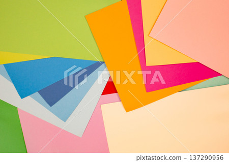 sheets of colored paper. Many colored sheets of paper are laid out in the harsh composition. background of colored paper. sheets of colored paper. Many colored sheets of paper are laid out in the harsh composition. background of colored paper. 137290956