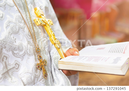 priest in the church near the throne with the cross 137291045