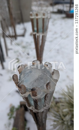 Icethemed Garden Ornament. Frozen Torch With Crystal Accents. Decorative Icy Torch With Seeds And Crystal Rim Icethemed Garden Ornament. Frozen Torch With Crystal Accents. Decorative Icy Torch With Seeds And Crystal Rim 137291268