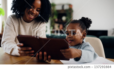 Mother and daughter learning technology together with tablet Mother and daughter learning technology together with tablet 137291664