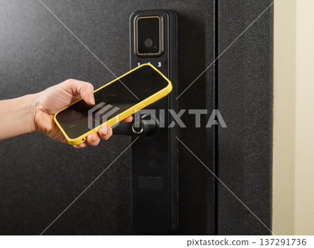 Modern smart door lock with digital keypad and keyless entry via smartphone. Modern smart door lock with digital keypad and keyless entry via smartphone. 137291736