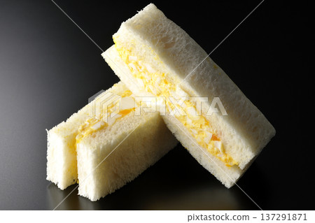 Egg sandwich photographed against a black background Egg sandwich photographed against a black background 137291871