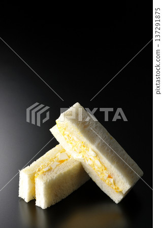 Egg sandwich photographed against a black background Egg sandwich photographed against a black background 137291875