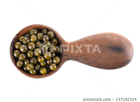 Pickled green peppercorns isolated on white background. Marinated unripe drupes of the Piper nigrum vine in wooden spoon. Clipping path. Top view. Pickled green peppercorns isolated on white background. Marinated unripe drupes of the Piper nigrum vine in wooden spoon. Clipping path. Top view. 137292324
