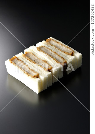 Photographing pork fillet cutlet sandwich against a black background Photographing pork fillet cutlet sandwich against a black background 137292458