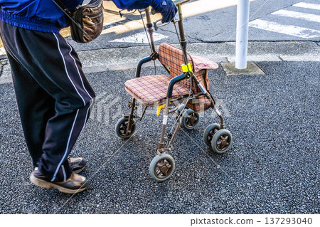 Yokohama cityscape in Japan, an aging society... An elderly man (wearing a mask) in a silver cart... = Yokohama city 137293040