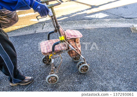 Yokohama cityscape in Japan, an aging society... An elderly man (wearing a mask) in a silver cart... = Yokohama city 137293061