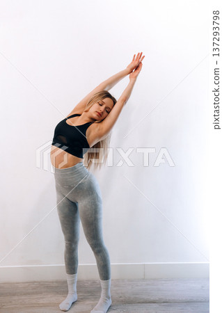 Portrait Of Beautiful Young Female Doing Exercising.Woman Stretching, And Enjoying Fitness Training And Healthy Lifestyle. Yoga For Health Portrait Of Beautiful Young Female Doing Exercising.Woman Stretching, And Enjoying Fitness Training And Healthy Lifestyle. Yoga For Health 137293798