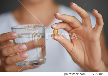 Happy Smiling Woman Taking Pill With Cod Liver Oil Omega-3 And Holding A Glass Of Fresh Water In Morning. Vitamin D, E, A Fish Oil Capsules. Diet. Nutrition. Happy Smiling Woman Taking Pill With Cod Liver Oil Omega-3 And Holding A Glass Of Fresh Water In Morning. Vitamin D, E, A Fish Oil Capsules. Diet. Nutrition. 137293855