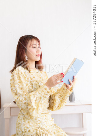 A woman reading a book A woman reading a book 137294015