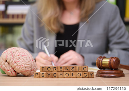 Exploring the intersection of law and mind with forensic psychology during a research session in the office 137294130