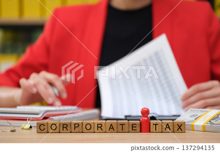 Exploring the complexities of corporate tax in a vibrant office setting with detailed financial reports 137294135