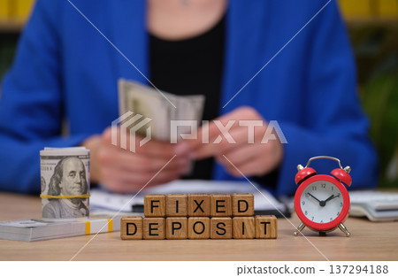 Exploring the benefits of fixed deposits with cash and time management on a smooth desktop Exploring the benefits of fixed deposits with cash and time management on a smooth desktop 137294188