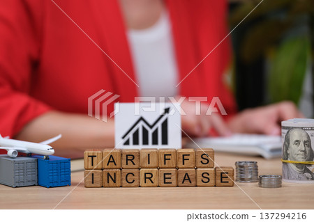 Exploring the impact of tariffs on trade during a business meeting in a vibrant office setting Exploring the impact of tariffs on trade during a business meeting in a vibrant office setting 137294216