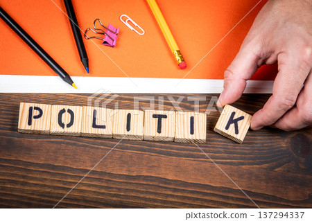 Politics Word In German POLITIK Wooden Letter Blocks On Desk Politics Word In German POLITIK Wooden Letter Blocks On Desk 137294337