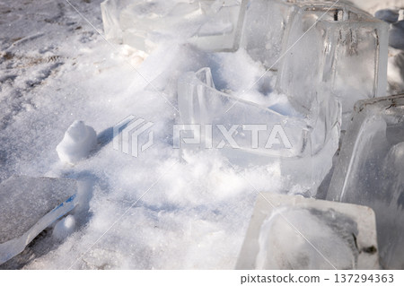 Large Ice Blocks And Broken Ice Pieces Outdoors On Snow Large Ice Blocks And Broken Ice Pieces Outdoors On Snow 137294363