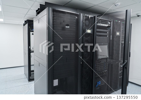 Modern data center server racks and network equipment in a secure, climate-controlled server room 137295550