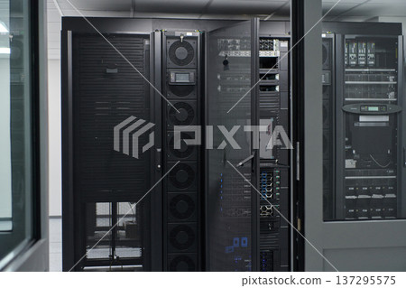 Data center server racks and network equipment in a secure IT room with cooling and cabling 137295575