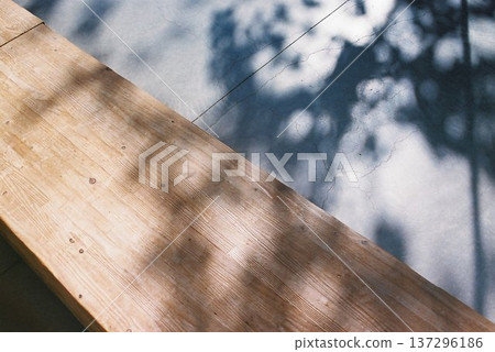 Contrast of sunlight filtering through the trees and shadows_Texture of wood and concrete Contrast of sunlight filtering through the trees and shadows_Texture of wood and concrete 137296186
