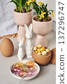 Decorative Bunnies with Easter Eggs and Yellow Flowers  Elegant Easter Interior Decor 137296747