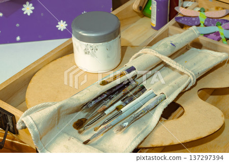 The art set includes brushes, a palette and chalk paintings, symbolising the idea of art and creativity. The art set includes brushes, a palette and chalk paintings, symbolising the idea of art and creativity. 137297394