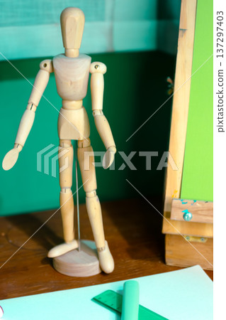 Wooden mannequin standing in art studio for drawing concept Wooden mannequin standing in art studio for drawing concept 137297403