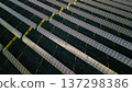 Aerial view of solar power station with diagonal rows of photovoltaic panels producing renewable electricity 137298386