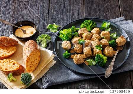 Belgian meatballs in creamy gravy with broccoli and bread Belgian meatballs in creamy gravy with broccoli and bread 137298439