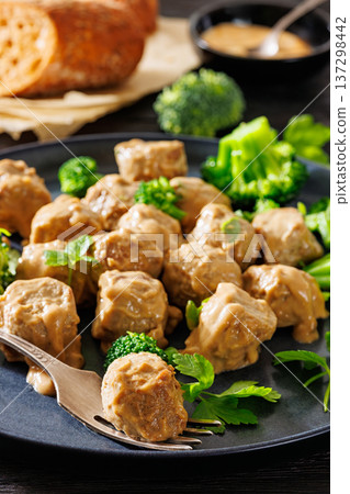 Belgian meatballs in creamy gravy with broccoli and bread Belgian meatballs in creamy gravy with broccoli and bread 137298442