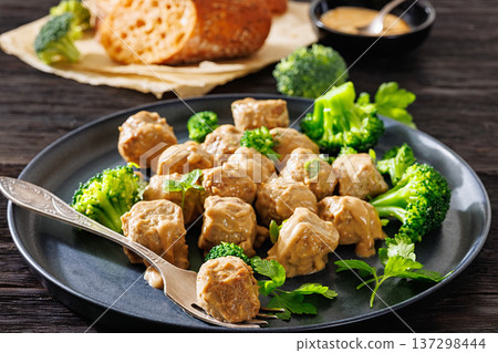 Belgian meatballs in creamy gravy with broccoli and bread Belgian meatballs in creamy gravy with broccoli and bread 137298444