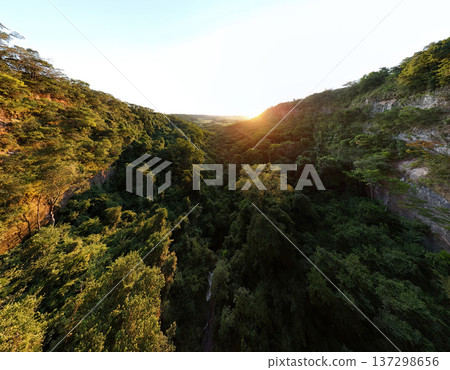 Cassilandia, Mato Grosso do Sul, Brazil - 04 05 2024: Sunrise canyon waterfall aerial Cassilandia, Mato Grosso do Sul, Brazil - 04 05 2024: Sunrise canyon waterfall aerial 137298656