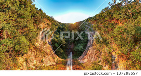 Cassilandia, Mato Grosso do Sul, Brazil - 04 05 2024: Sunrise canyon waterfall aerial 137298657