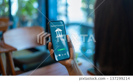 Payment successful online banking smartphone finance digital woman hand money transaction. Female using mobile fintech technology for easy electronic wallet transfer at cafe. Payment successful online banking smartphone finance digital woman hand money transaction. Female using mobile fintech technology for easy electronic wallet transfer at cafe. 137299214