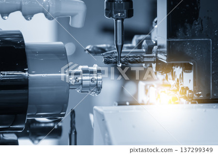 Close-up of simultaneous multi-axis machining on a Swiss-type CNC multi-tasking machine producing high-precision components. 137299349