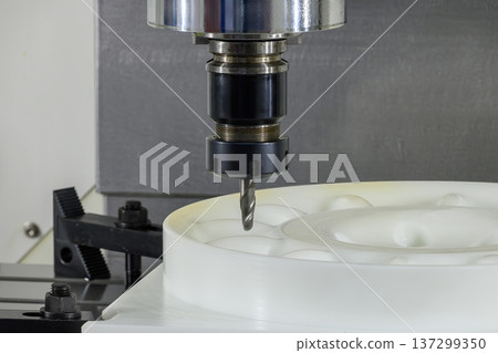 High-precision CNC milling of engineering nylon (polyamide) using a solid carbide ball nose end mill for complex 3D contouring. 137299350