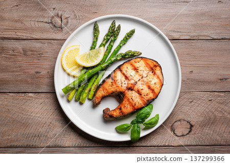 Grilled salmon fish steak and roasted asparagus Grilled salmon fish steak and roasted asparagus 137299366