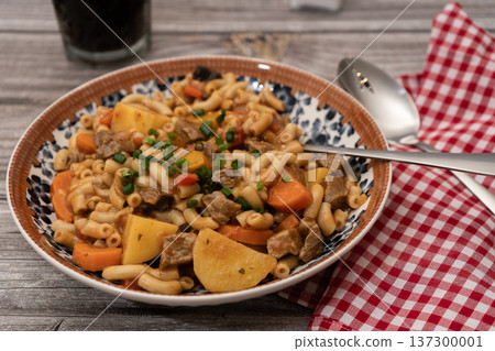 Hearty beef goulash stew with macaroni pasta and vegetables 137300001