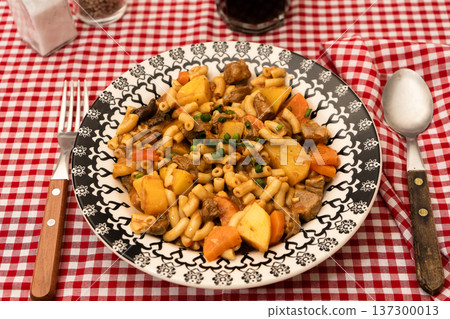 Hearty beef goulash stew with pasta and vegetables Hearty beef goulash stew with pasta and vegetables 137300013