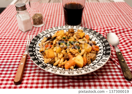 Hearty beef goulash with macaroni pasta and vegetables Hearty beef goulash with macaroni pasta and vegetables 137300019