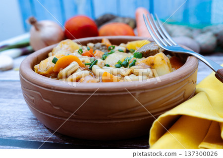 Noodle stew with meat and vegetables for lunch Noodle stew with meat and vegetables for lunch 137300026