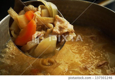 Pork soup ingredients scooped out of the pot 137301246
