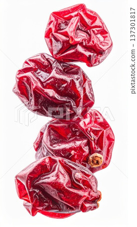 Studio Shot of Four Bright Red Dried Cranberries Stacked Vertically on White Background 137301817