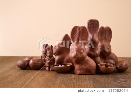 Chocolate bunnies and easter eggs celebrating spring holiday Chocolate bunnies and easter eggs celebrating spring holiday 137302054